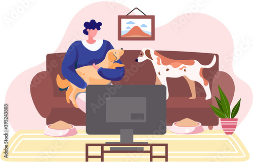 A woman hug her dogs with warmth and love, the concept of the relationship between humans and their pets. Female sitting on sofa in front of tv in livingroom with her domestic animals at home together