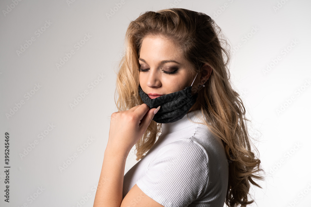 Young woman is wearing a face mask for protection against virus COVID-19 SARS, SARS-CoV, virus 2020 chinese virus 2019-nCoV Young woman is wearing a face mask for protection against virus COVID-19 SARS, SARS-CoV, virus 2020 chinese virus 2019-nCoV