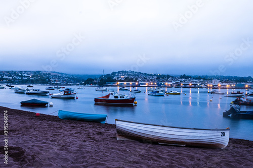 Boats moored on the Teign river in between Shaldon and Teignmouth  Devon at Dusk.