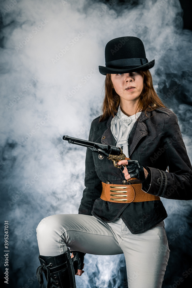 Steampunk. The character is a girl in a hat. Young woman. Studio photography. Portrait. Steampunk. The character is a girl in a hat. Young woman. Studio photography. Portrait.
