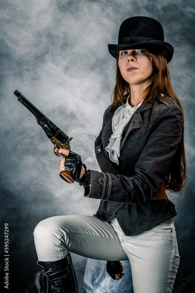 Steampunk. The character is a girl in a hat. Young woman. Studio photography. Portrait. Steampunk. The character is a girl in a hat. Young woman. Studio photography. Portrait.