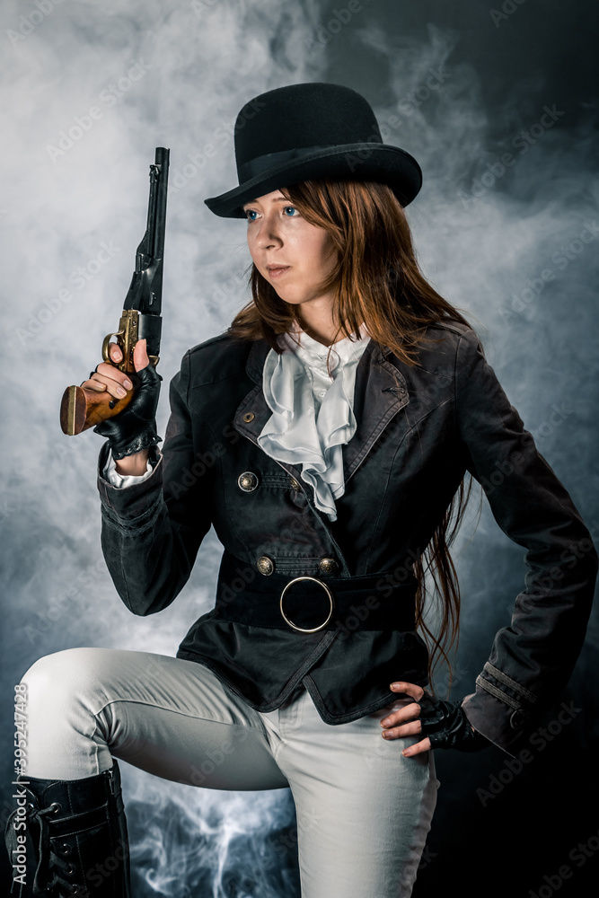 Steampunk. The character is a girl in a hat. Young woman. Studio photography. Portrait. Steampunk. The character is a girl in a hat. Young woman. Studio photography. Portrait.