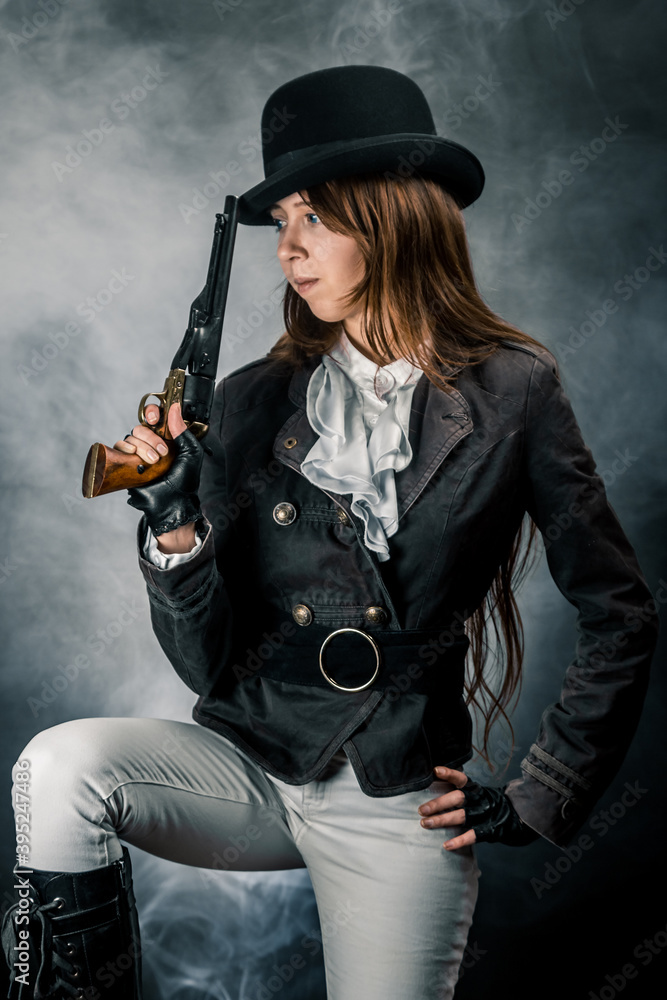 Steampunk. The character is a girl in a hat. Young woman. Studio photography. Portrait. Steampunk. The character is a girl in a hat. Young woman. Studio photography. Portrait.