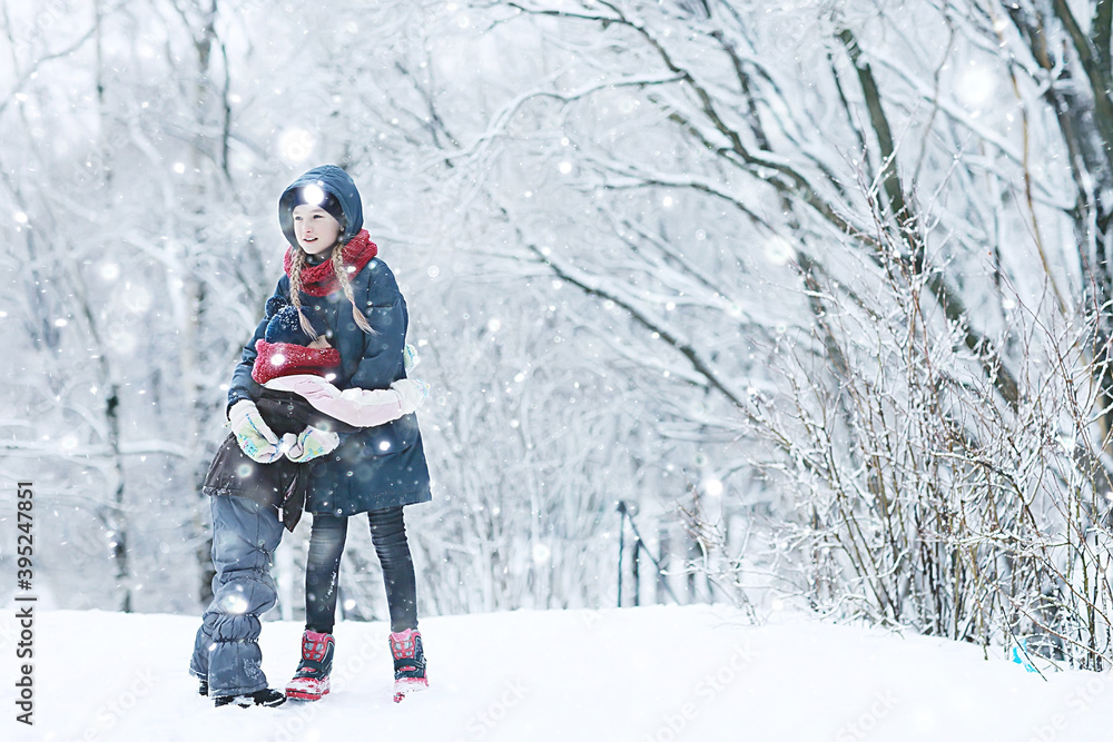 two sisters girls winter for a walk / young girlfriends playing in the snow in the frost. The concept of childhood, friendship, family. Sports warm clothes, health immunity. Christmas morning. two sisters girls winter for a walk / young girlfriends playing in the snow in the frost. The concept of childhood, friendship, family. Sports warm clothes, health immunity. Christmas morning.