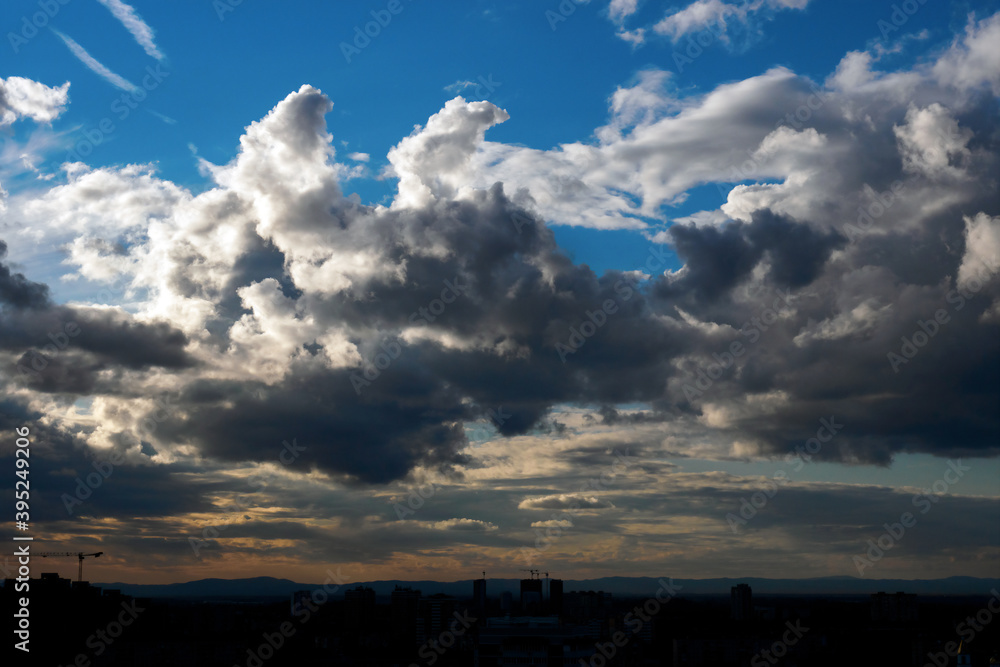 Clouds and blue sky over the city horizon