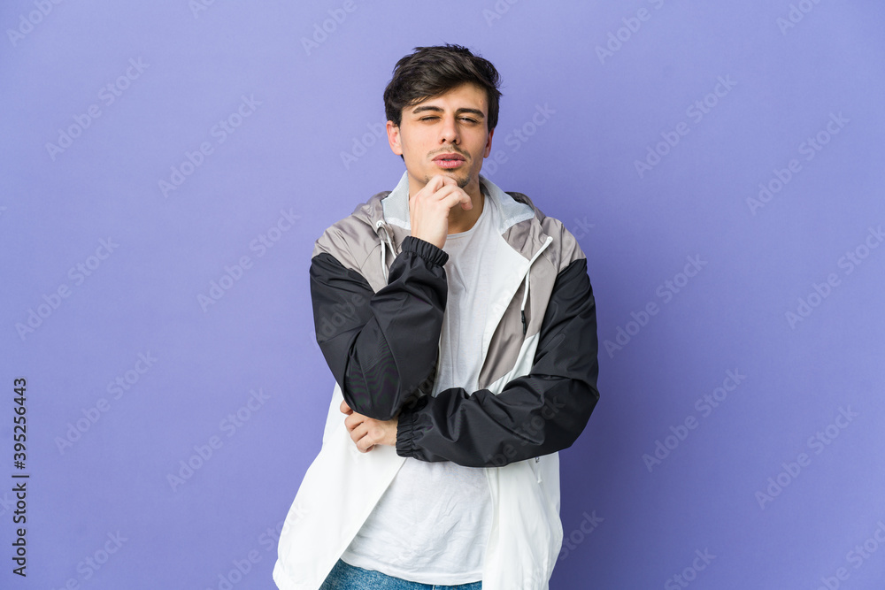 Young cool man thinking and looking up, being reflective, contemplating, having a fantasy. Young cool man thinking and looking up, being reflective, contemplating, having a fantasy.