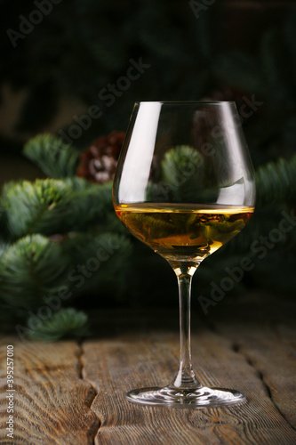 glass of white wine christmas background. New Year celebration concept