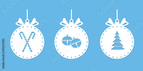 Christmas balls with an ornament. Stencil for paper cutting, laser cut silhouette, printing, scrapbooking template. Cutout paper balls with bells pattern, Christmas tree, candy cane. Xmas decoration