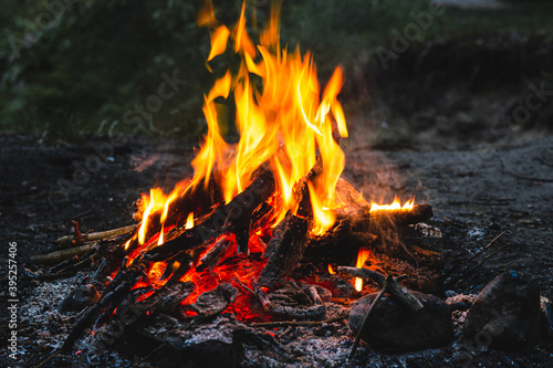 Bright hot campfire on a dark night