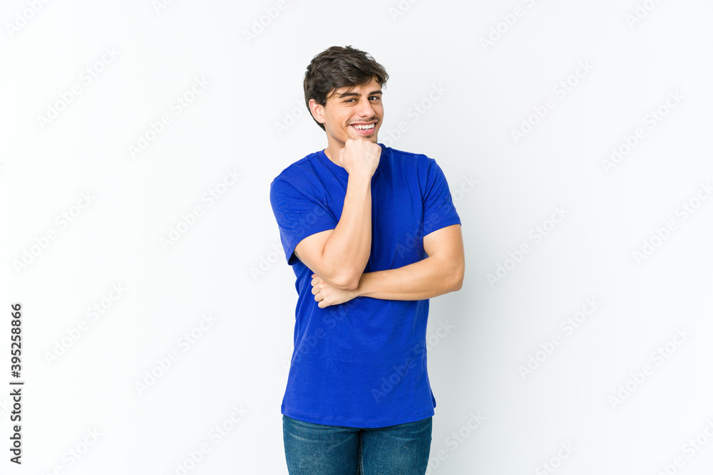 Young cool man smiling happy and confident, touching chin with hand. Young cool man smiling happy and confident, touching chin with hand.