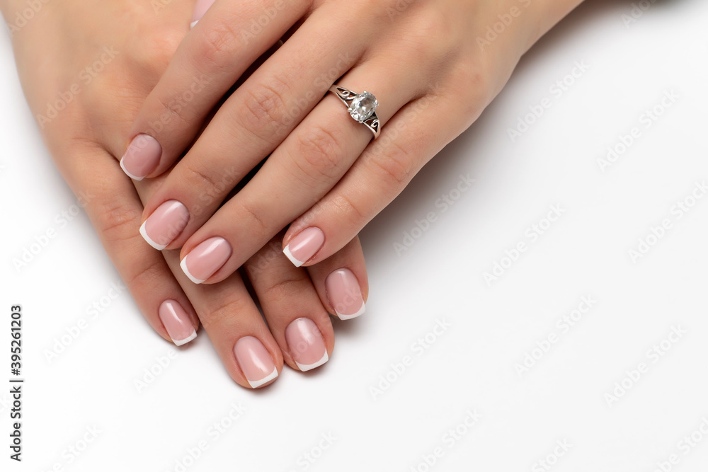 Wedding French manicure on short square nails. Ring on a finger. Wedding French manicure on short square nails. Ring on a finger.