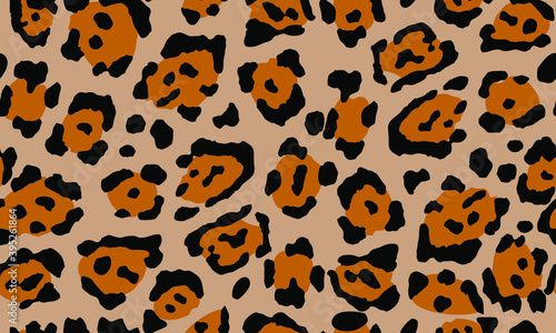Leopard print. Trendy seamless vector print. The texture of the animals. Jaguar spots on a beige background. Imitation of cheetah skin painted on clothes or fabric, modern textile