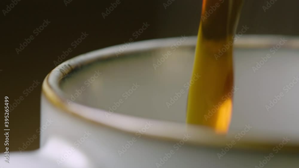 CLOSE UP coffee pours into a cup and is left steaming, 60fps CLOSE UP coffee pours into a cup and is left steaming, 60fps