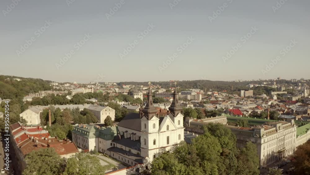 City panorama from above. Lviv, an old European city. City hall, temples, buildings with red roofs and streets on a sunny day City panorama from above. Lviv, an old European city. City hall, temples, buildings with red roofs and streets on a sunny day