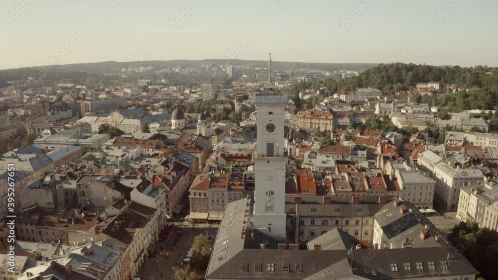 City panorama from above. Lviv, an old European city. City hall, temples, buildings with red roofs and streets on a sunny day City panorama from above. Lviv, an old European city. City hall, temples, buildings with red roofs and streets on a sunny day
