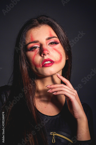 woman with make up face for halloween clown