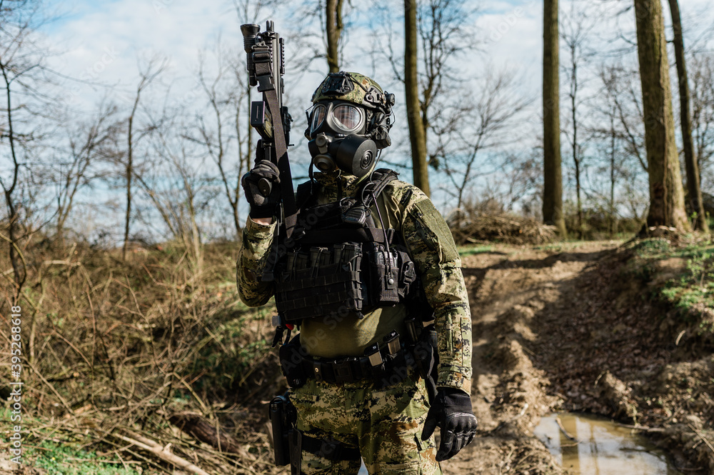 Croatian soldier in Cropat woodland uniform wearing gas mask M95 and assault rifle G36. Croatian soldier in Cropat woodland uniform wearing gas mask M95 and assault rifle G36.