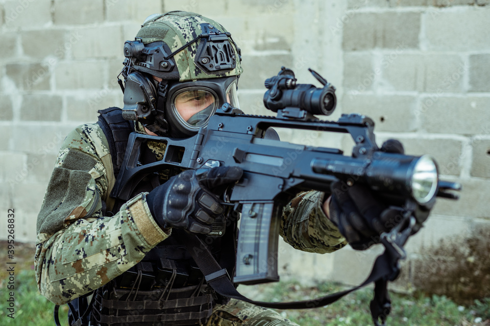 Croatian soldier in Cropat woodland uniform wearing gas mask M95 and assault rifle G36. Croatian soldier in Cropat woodland uniform wearing gas mask M95 and assault rifle G36.