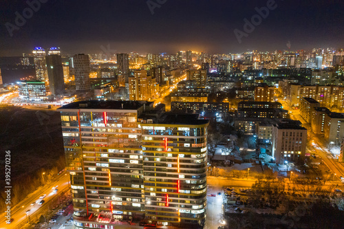 Aerial view of the night modern city. Bright lights of the night streets. Ekaterinburg. Russia