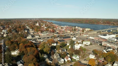 Drone shot of city on river banks in autumn, Bath, Maine photo
