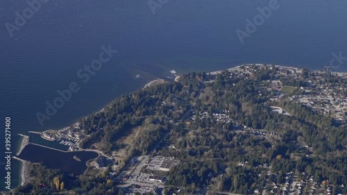 Laskesti and Texada Island -The Gorgeous Scenery Of A Blue Calm Ocean Composed Of Buildings and Green Trees - Aerial Shot photo