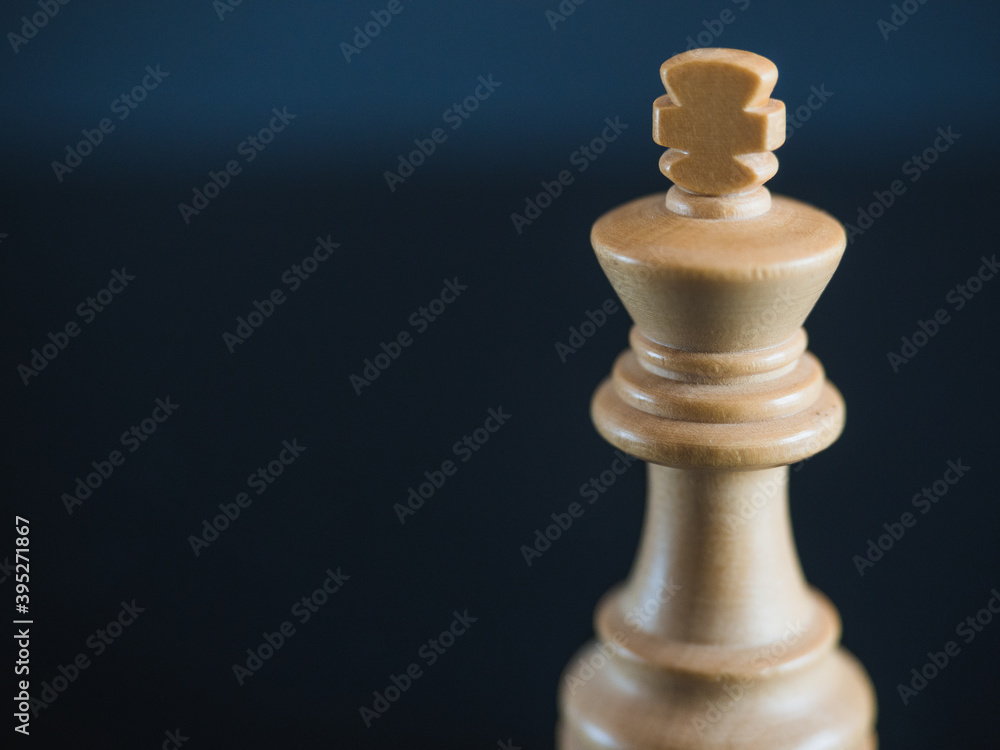 White king, wooden chess figure isolated. Concept strategy leadership with copy space White king, wooden chess figure isolated. Concept strategy leadership with copy space