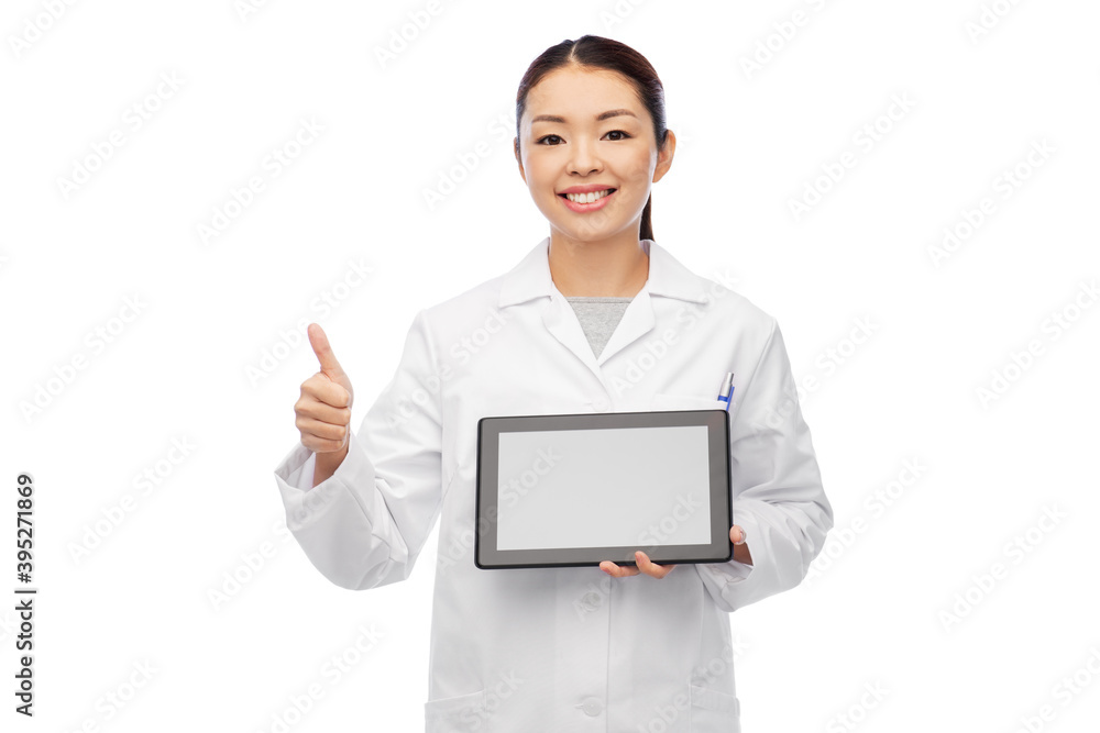 medicine, profession and healthcare concept - happy smiling asian female doctor or scientist in lab coat with tablet pc computer and stethoscope showing thumbs up over white background medicine, profession and healthcare concept - happy smiling asian female doctor or scientist in lab coat with tablet pc computer and stethoscope showing thumbs up over white background