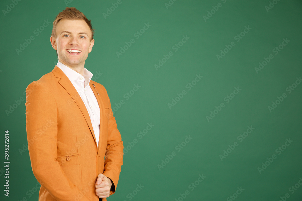 Attractive caucasian adult male wearing orange jacket Attractive caucasian adult male wearing orange jacket