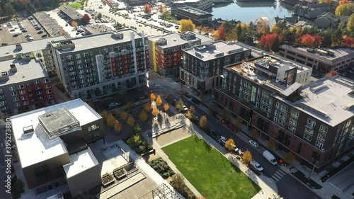 Aerial / drone footage of the new Spring District in Bellevue, Washington downtown with residential and commercial highrise buildings along Interstate highway 405 in King County photo