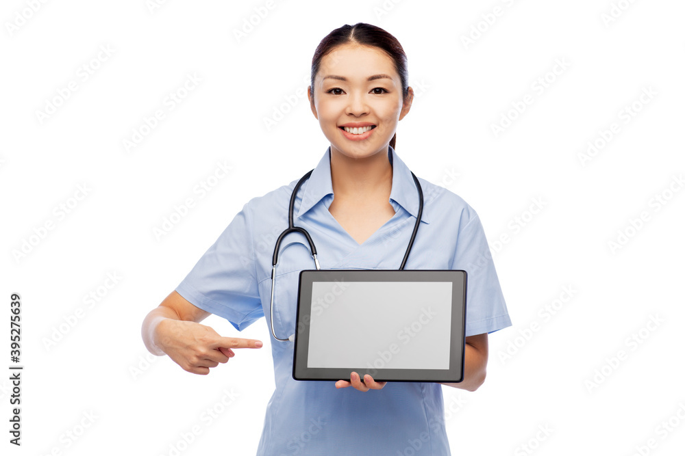 medicine, profession and healthcare concept - happy smiling asian female doctor or nurse in blue uniform with tablet pc computer and stethoscope over white background medicine, profession and healthcare concept - happy smiling asian female doctor or nurse in blue uniform with tablet pc computer and stethoscope over white background
