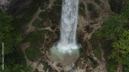 Wildenstein Waterfall splashing base in the southern Austrian Alps , Aerial pedestal up reveal shot photo