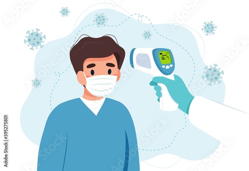 Body temperature check, man is being checked with infrared thermometer.