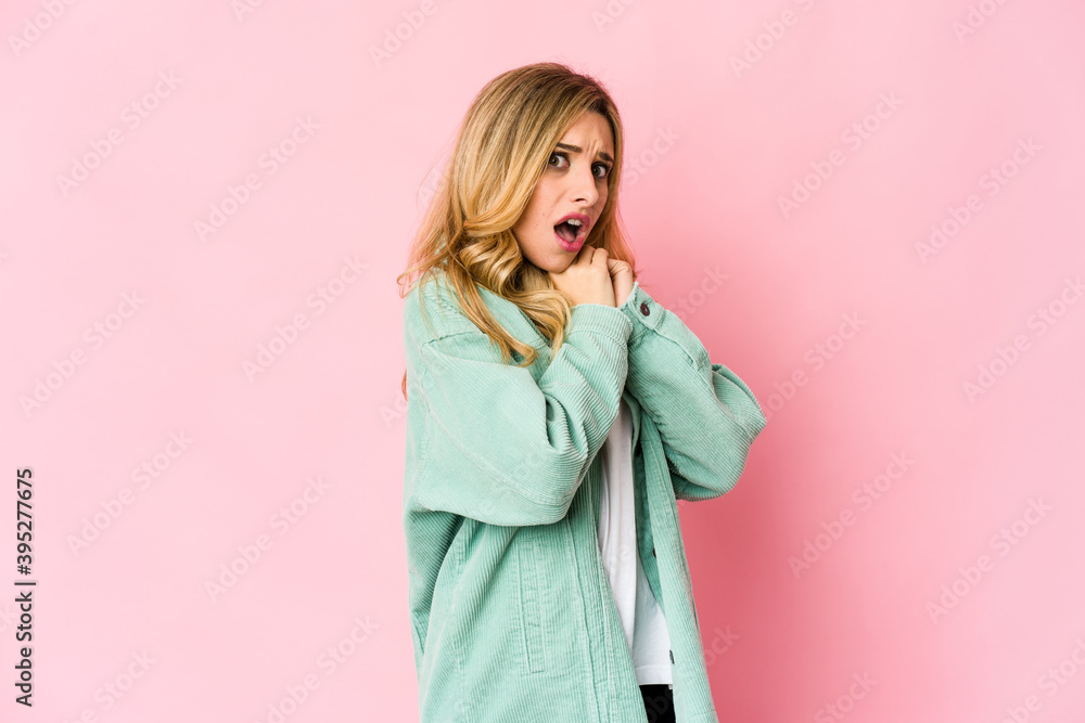 Young caucasian blonde woman scared and afraid. Young caucasian blonde woman scared and afraid.