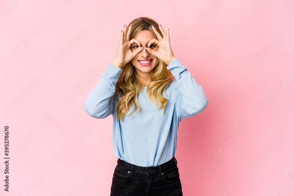 Young caucasian blonde woman covering ears with hands.