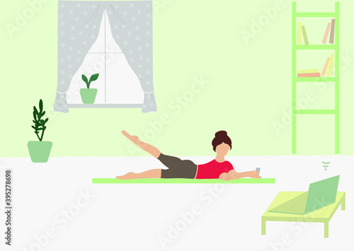 The girl is engaged in physical education at home. Stay home and learn something new. Lessons on the video lessons. Sports lifestyle in quarantine.
