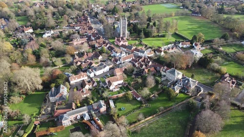 A drone flight over Dedham on the Essex/Suffolk border towards the church with views of the whole village and surrounding countryside including the High Street. photo