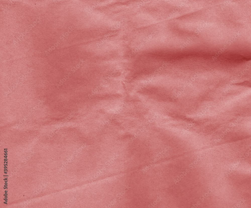 Fototapeta premium red toned craft paper with wrinckles surface.