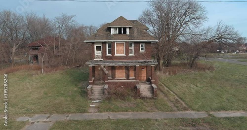 Drone view of dilapidated house in a Detroit neighborhood. This video was filmed in 4k for best image quality. photo