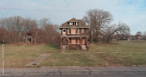 Drone view of dilapidated house in a Detroit neighborhood. This video was filmed in 4k for best image quality. photo