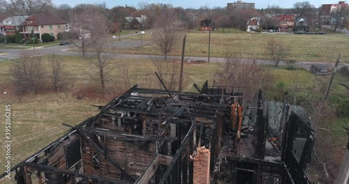Drone view of dilapidated house in a Detroit neighborhood. This video was filmed in 4k for best image quality.