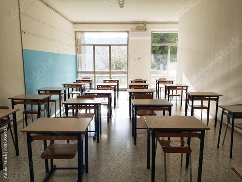 Empty classroom with desks without pupils due to covid-19