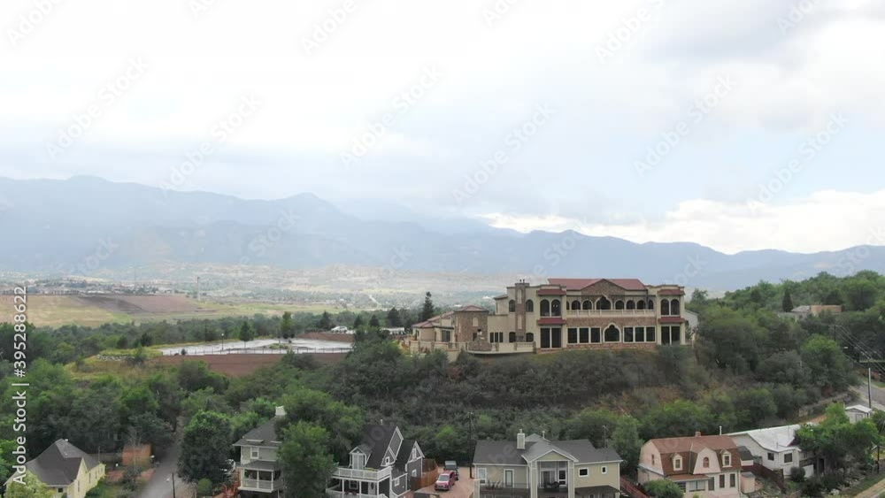 AERIAL View of town with hotel and mountains AERIAL View of town with hotel and mountains