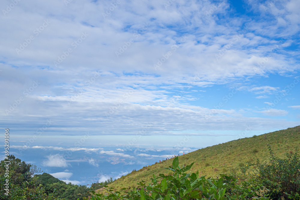 Beautiful scenic view of mountains and clouds against the sky in Kew Mae Pan nature trail at Doi Inthanon, Chiang Mai, Thailand. Famous tourist attractions of Thailand. Concept of holiday and travel