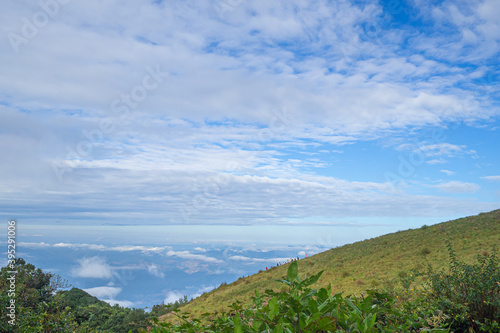Beautiful scenic view of mountains and clouds against the sky in Kew Mae Pan nature trail at Doi Inthanon, Chiang Mai, Thailand. Famous tourist attractions of Thailand. Concept of holiday and travel