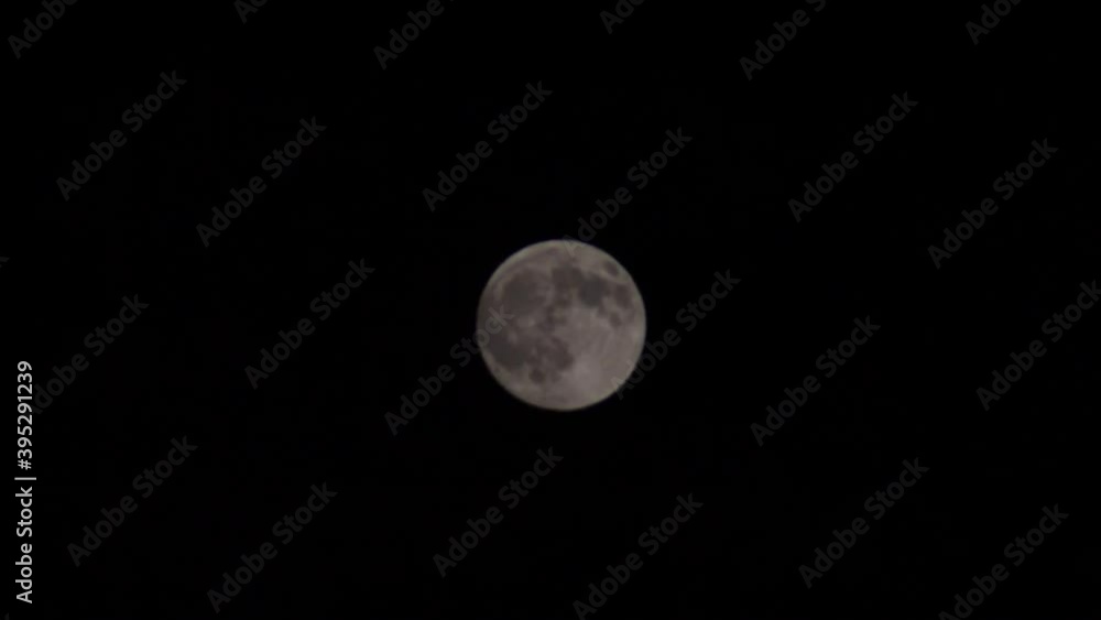 A time-lapse of cloud light moving inside the moon on a dark sky A time-lapse of cloud light moving inside the moon on a dark sky