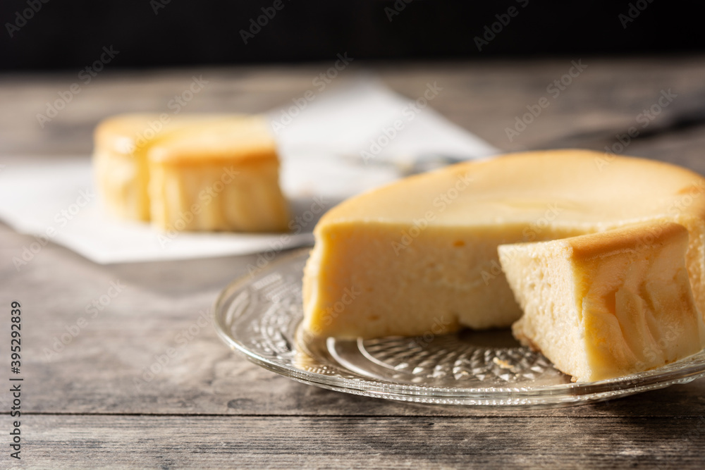 Traditional New York cheesecake on wooden table Traditional New York cheesecake on wooden table