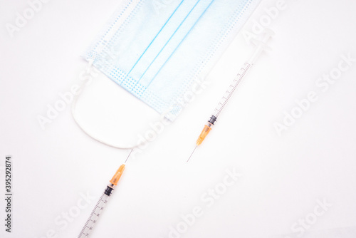 Syringes and surgical mask photo