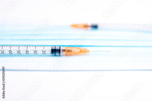 Syringes and surgical mask photo