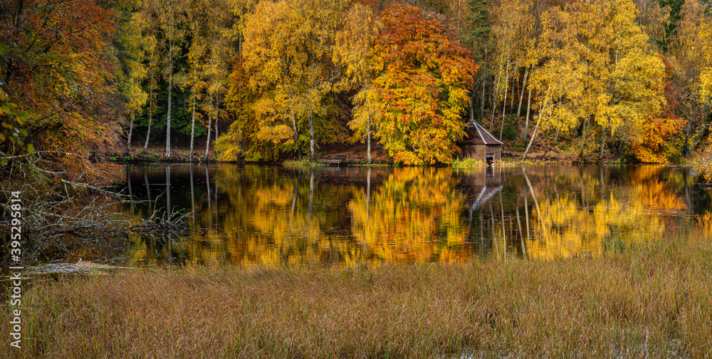 Autumn colours at the boathouse on Loch Dunmore near Pitlochry in the Scottish Highlands Autumn colours at the boathouse on Loch Dunmore near Pitlochry in the Scottish Highlands