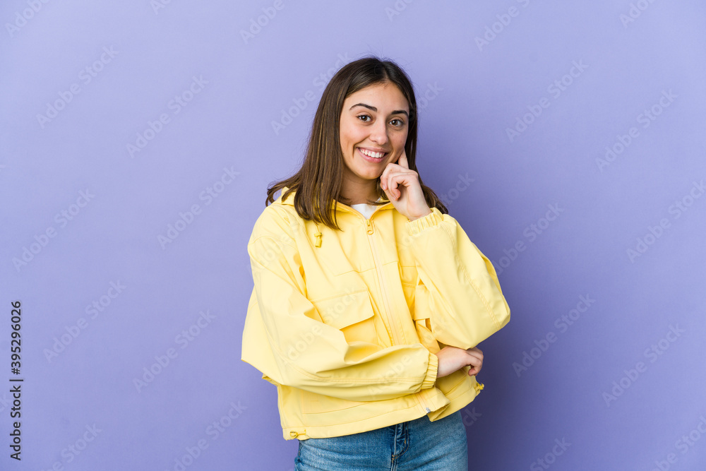 Young caucasian woman smiling happy and confident, touching chin with hand. Young caucasian woman smiling happy and confident, touching chin with hand.